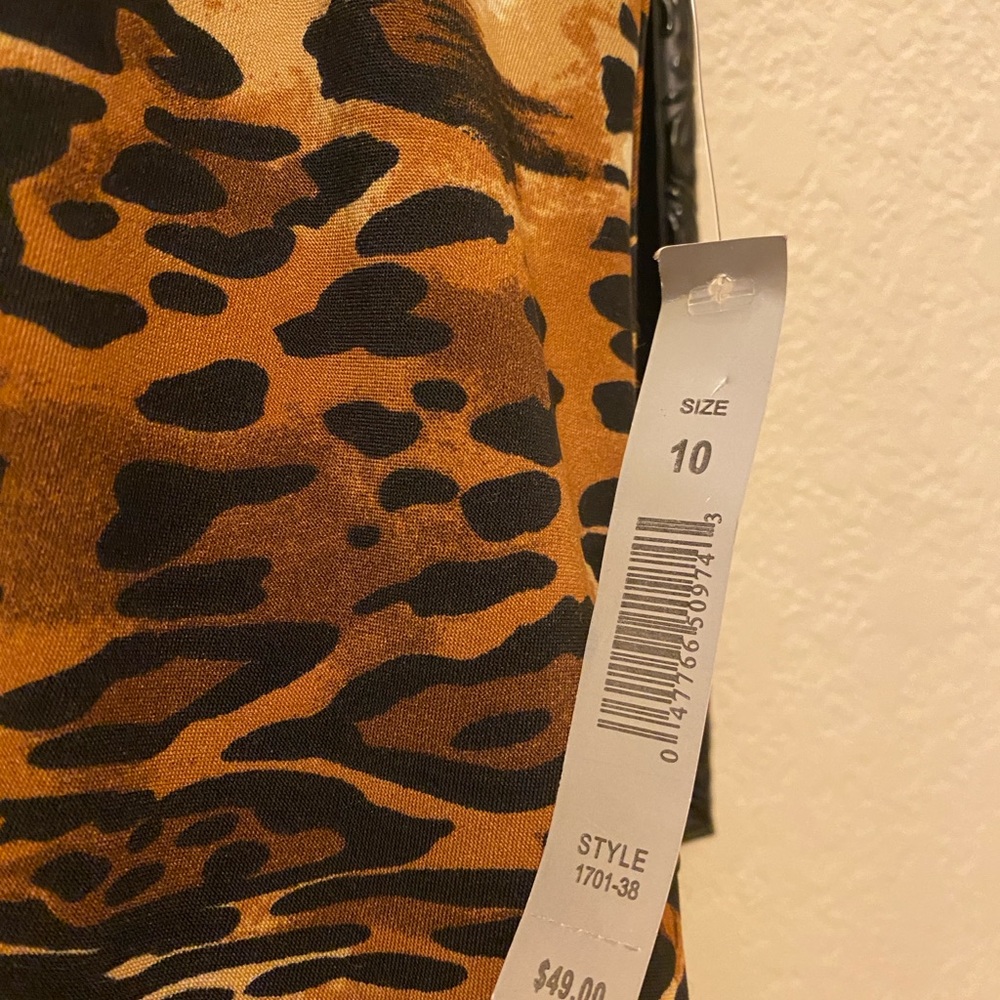 Animal print dress with gold grommets around neckline. Size 10, back zipper. NWT - Picture 3 of 4